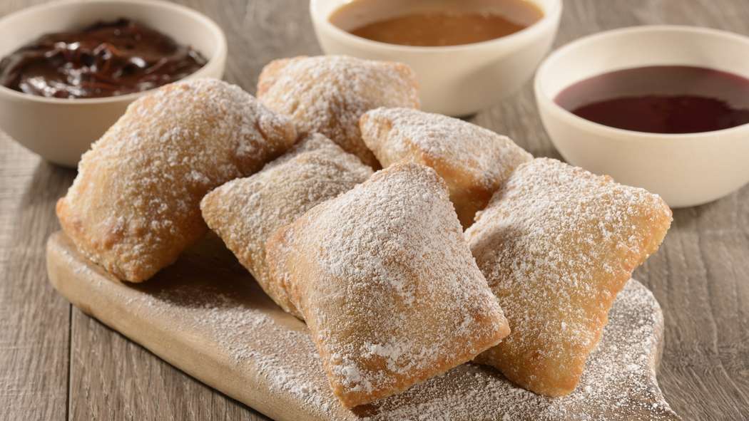 Celebrate Mardi Gras with Beignets from Sassagoula Floatworks and Food Factory at Disney’s Port Orleans Resort – French Quarter